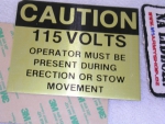 Samolepa Alu Caution 110V